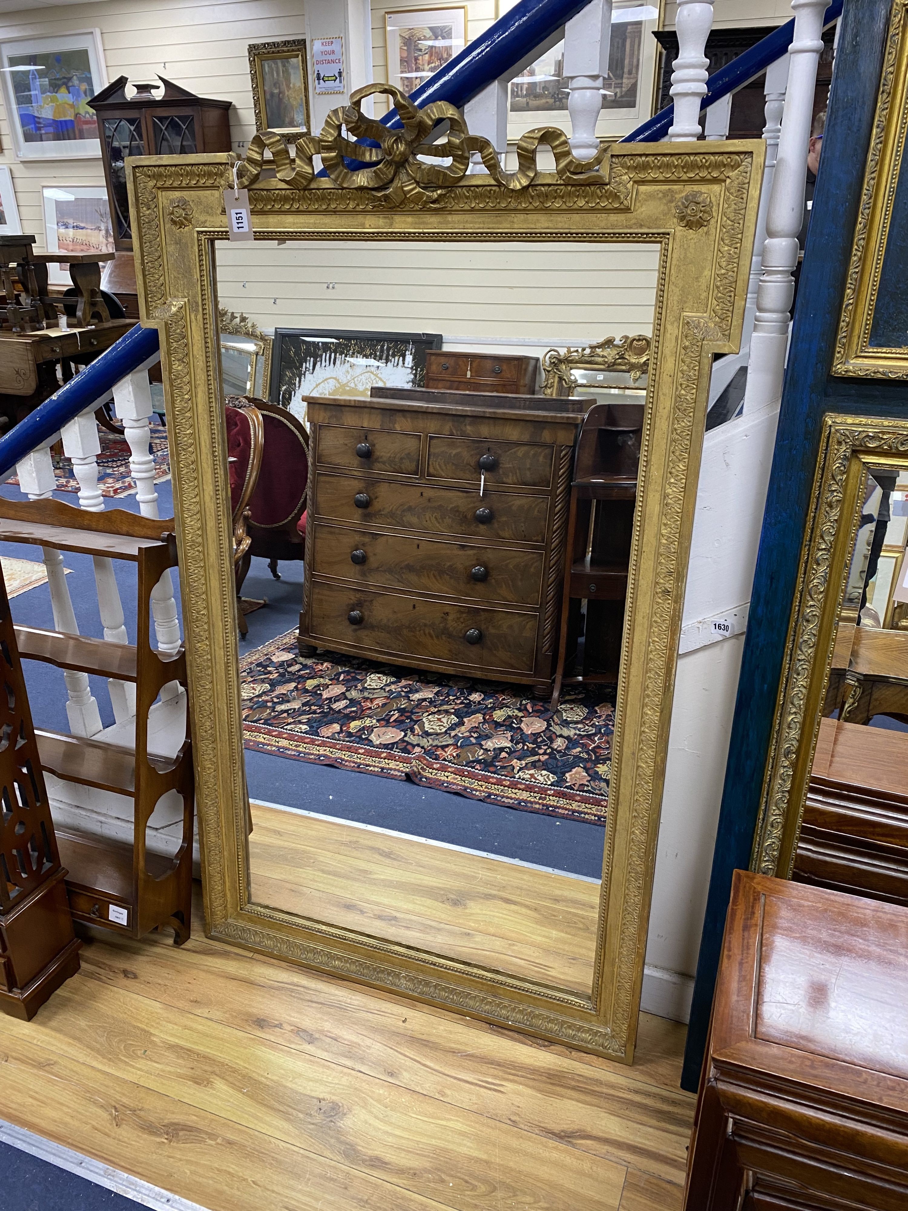A gilt overmantel mirror, width 94cm, height 152cm